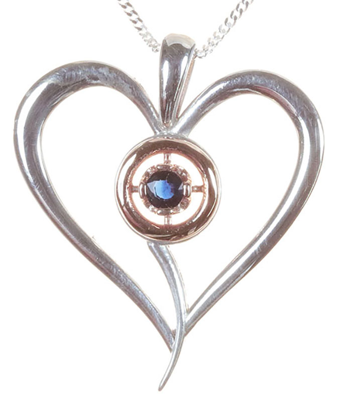 silver and rose gold heart set with a sapphire Heart pendant